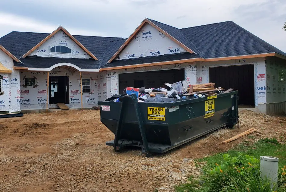 Trash Box Roll-Off Dumpster at a new construction home